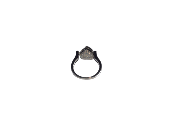 Sterling silver ring featuring pear-shaped setting with sparkling stones