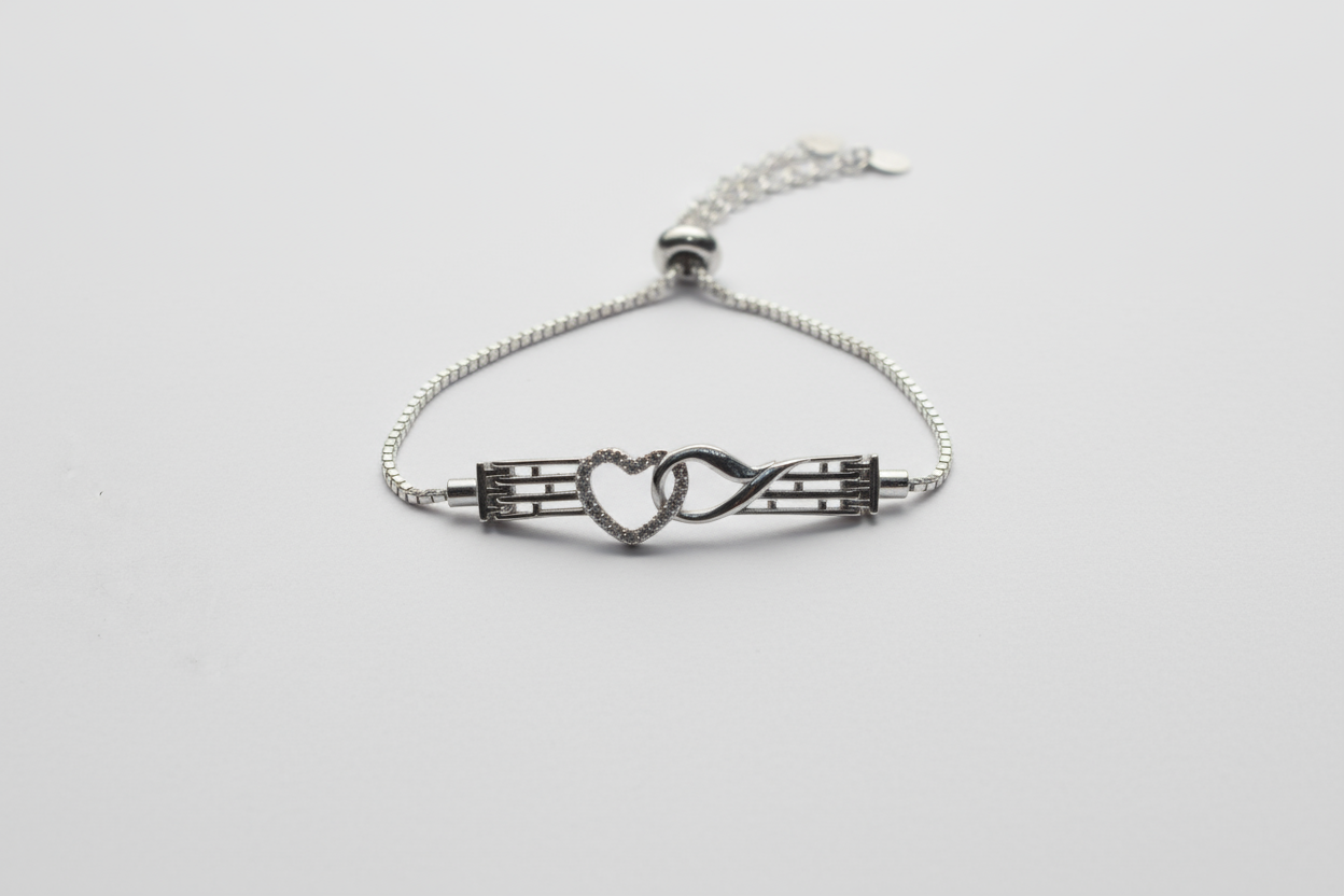 A highly polished 925 sterling silver bracelet with a heart link, showcasing the texture of the fine chain and the quality of the metal.