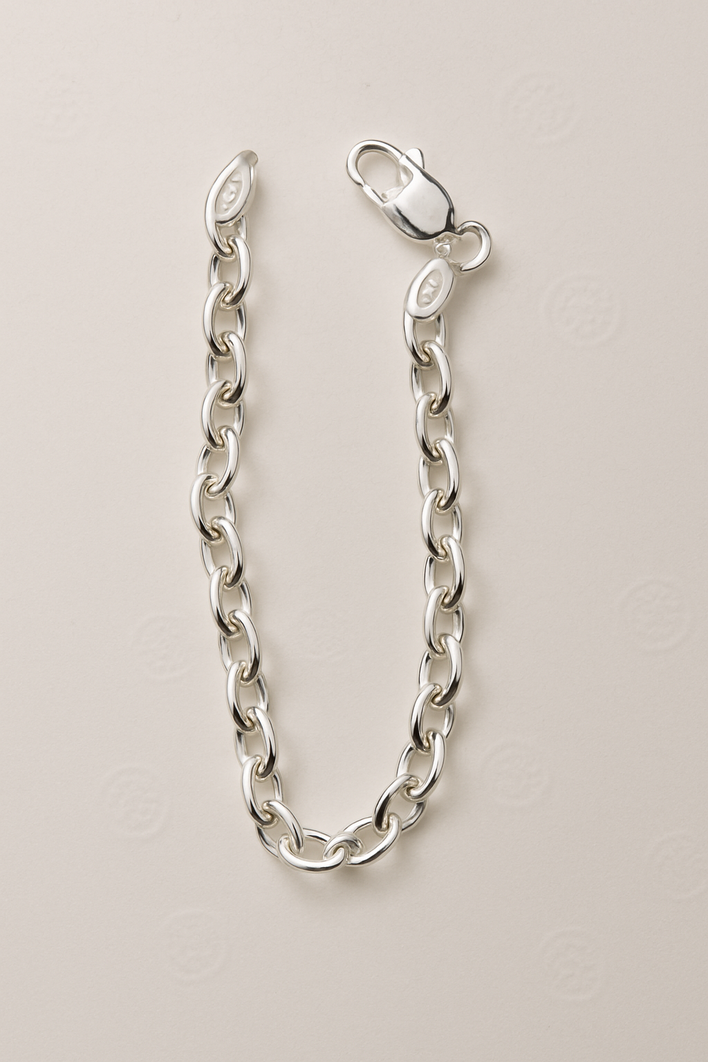 Madhisha Silvers classic sterling silver oval link bracelet with polished finish and secure lobster clasp.