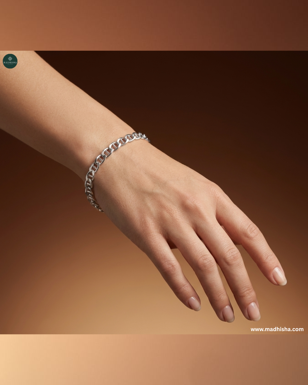 Close-up lifestyle image of Icon Chain 925 sterling silver bracelet showcasing polished interlocking links on a female wrist.