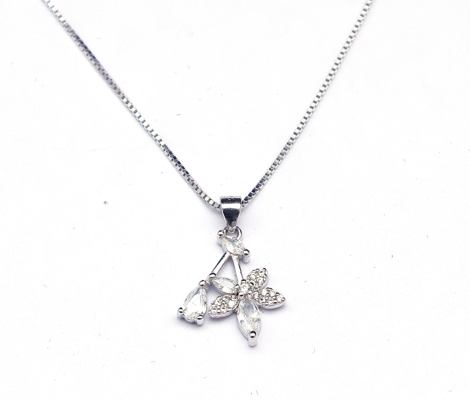 Elegant petal design silver necklace set for women with sparkling stones